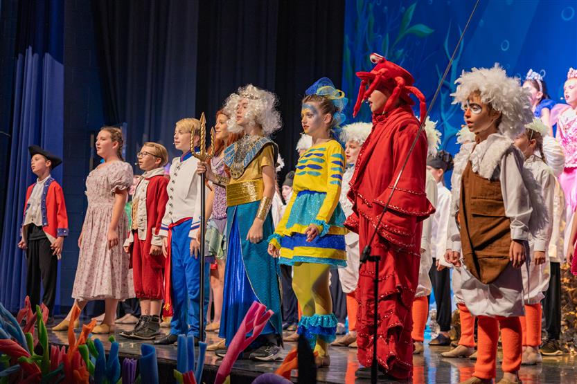 Students perform onstage